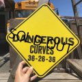 70s Vintage Cardboard Sign DENGEROUS CURVES (B292)