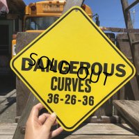 70s Vintage Cardboard Sign DENGEROUS CURVES (B292)